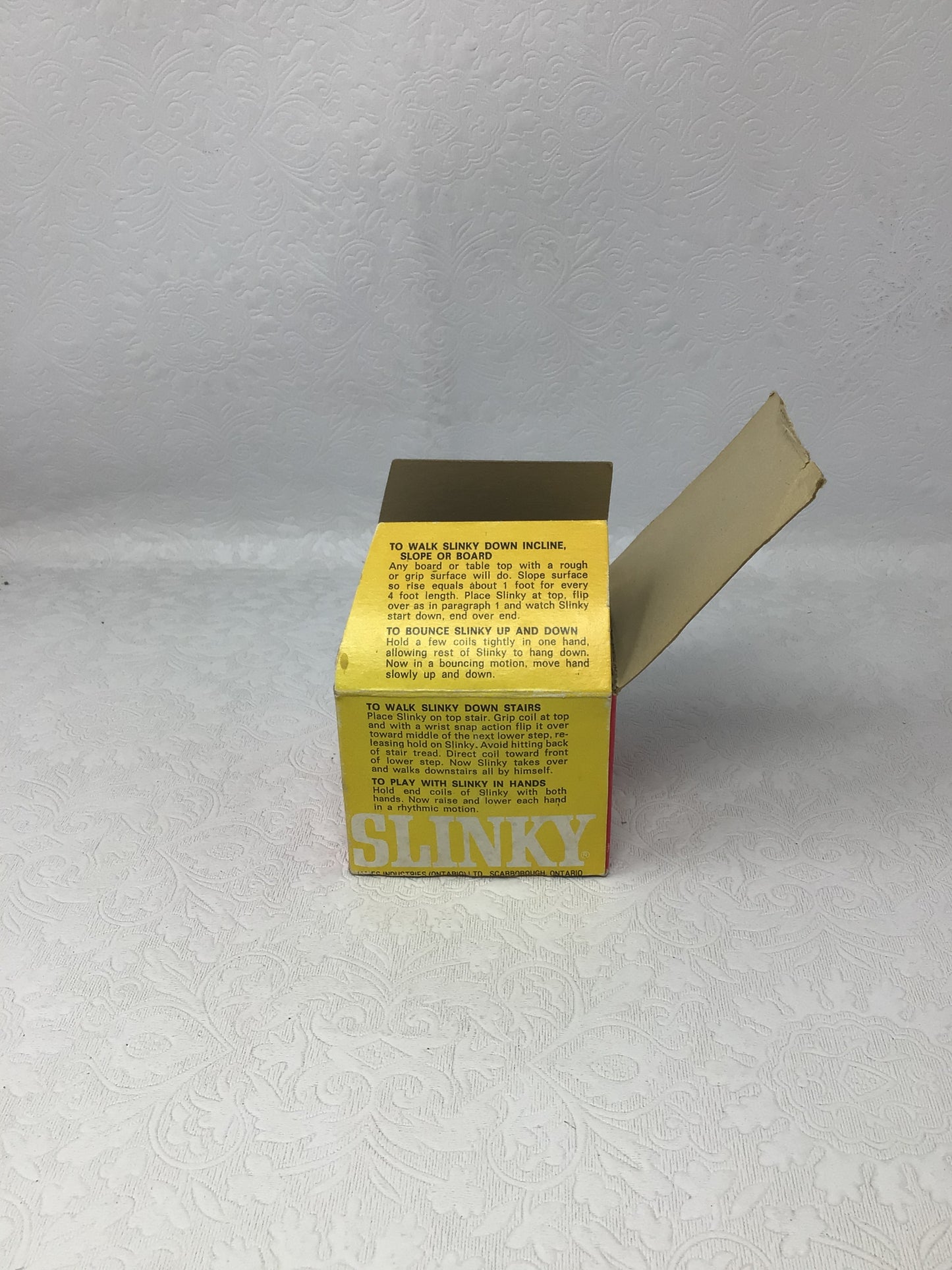 Vintage James Industries Metal Slinky Toy