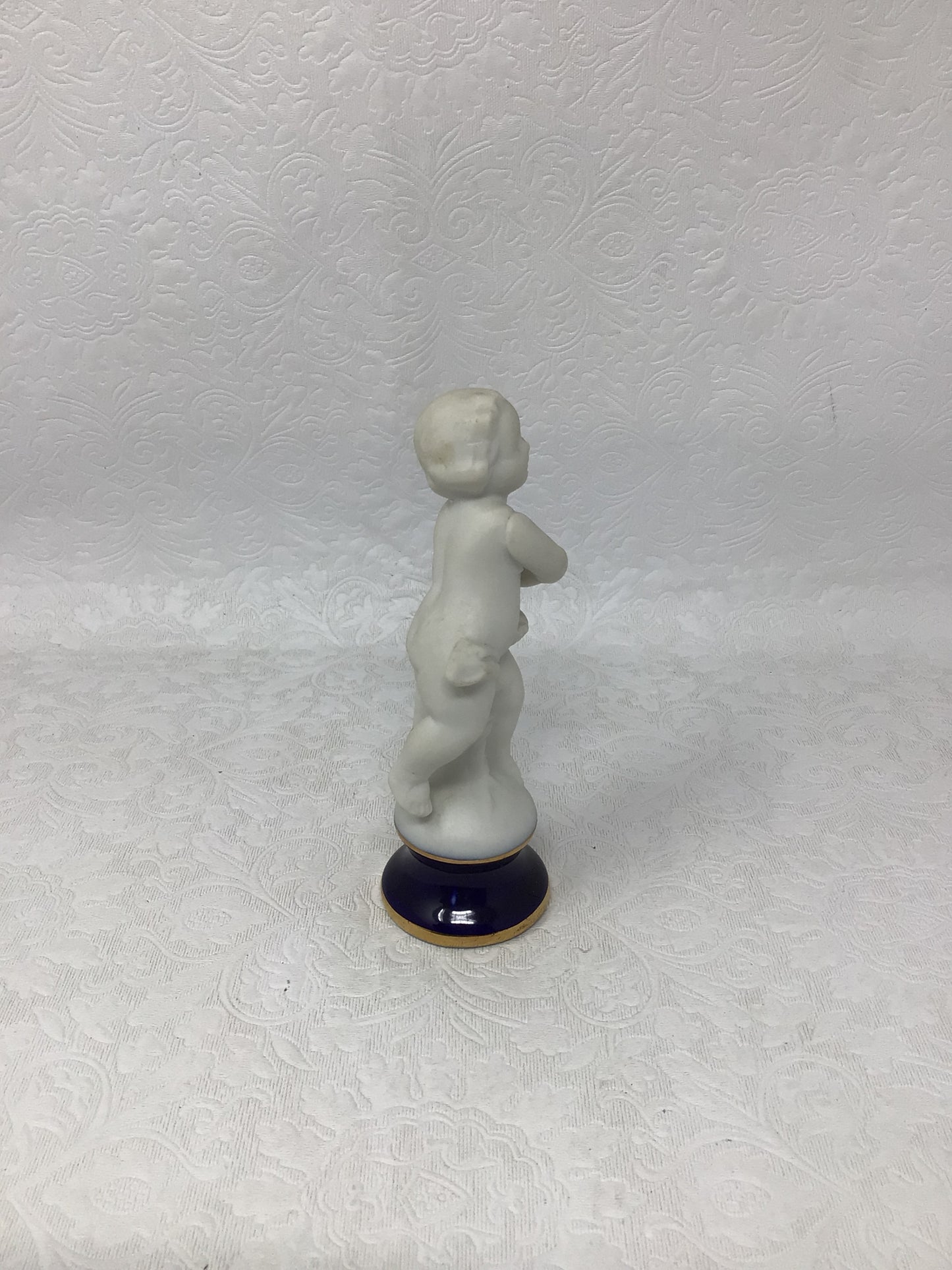Porcelain Child Figurine