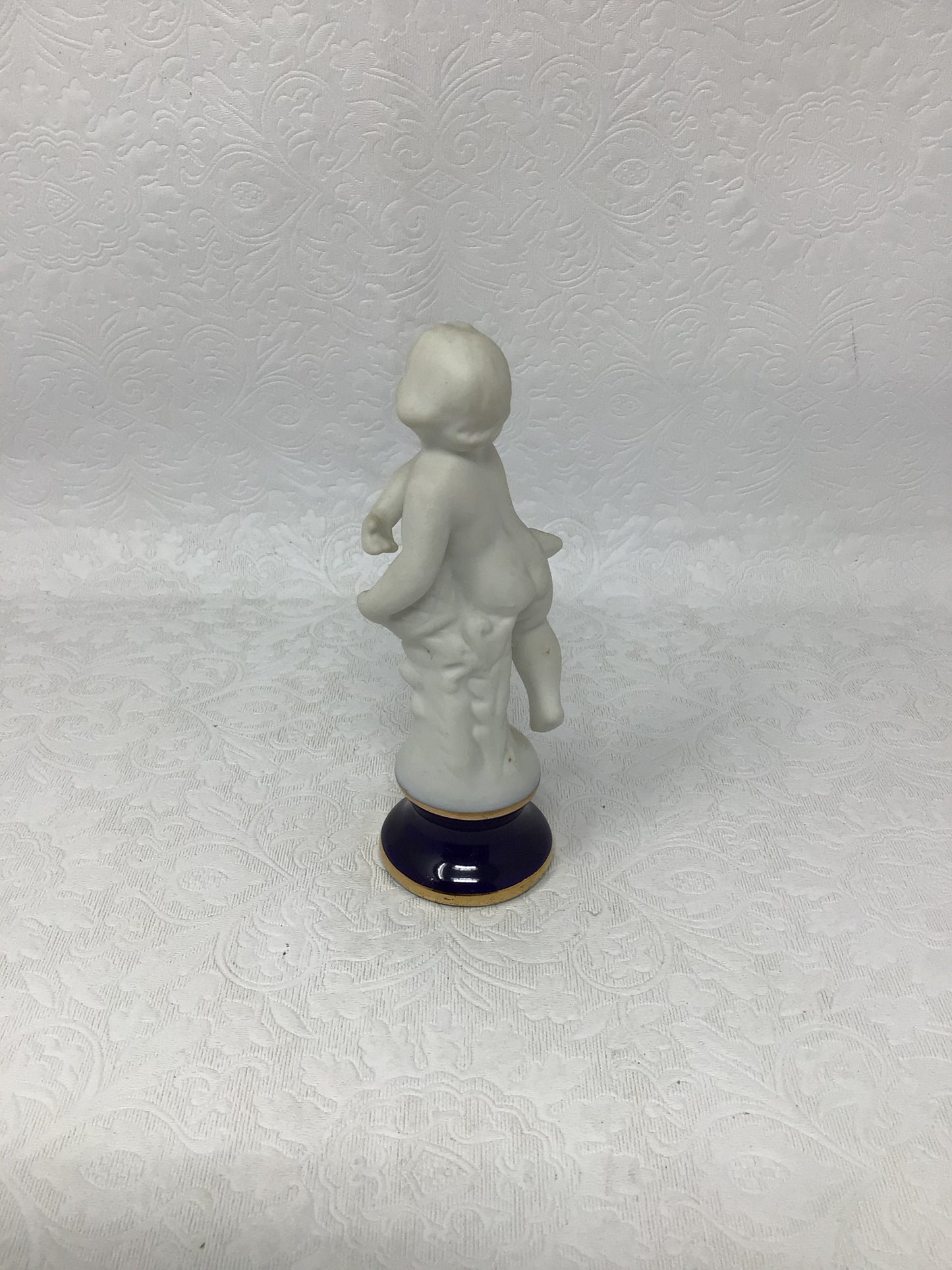 Porcelain Child Figurine