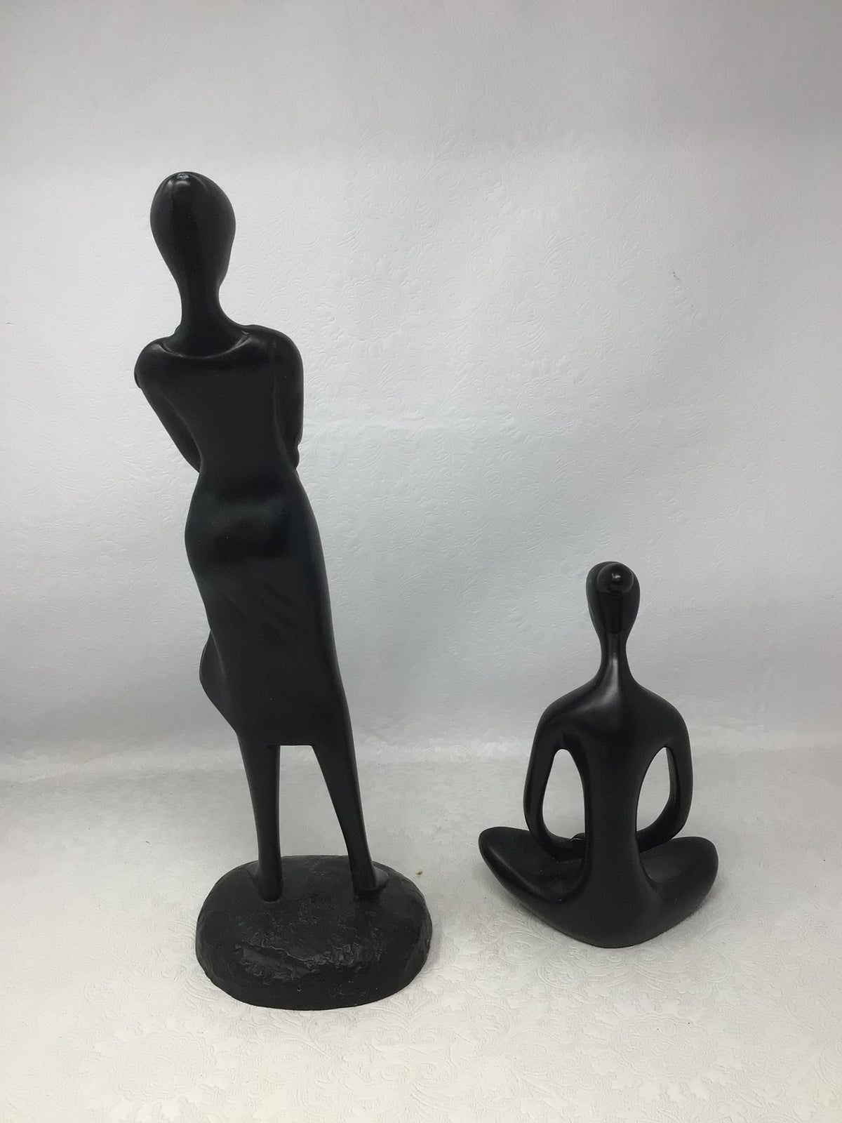 Wooden Carvings of Seated Woman and Woman Carrying Child, Set of 2