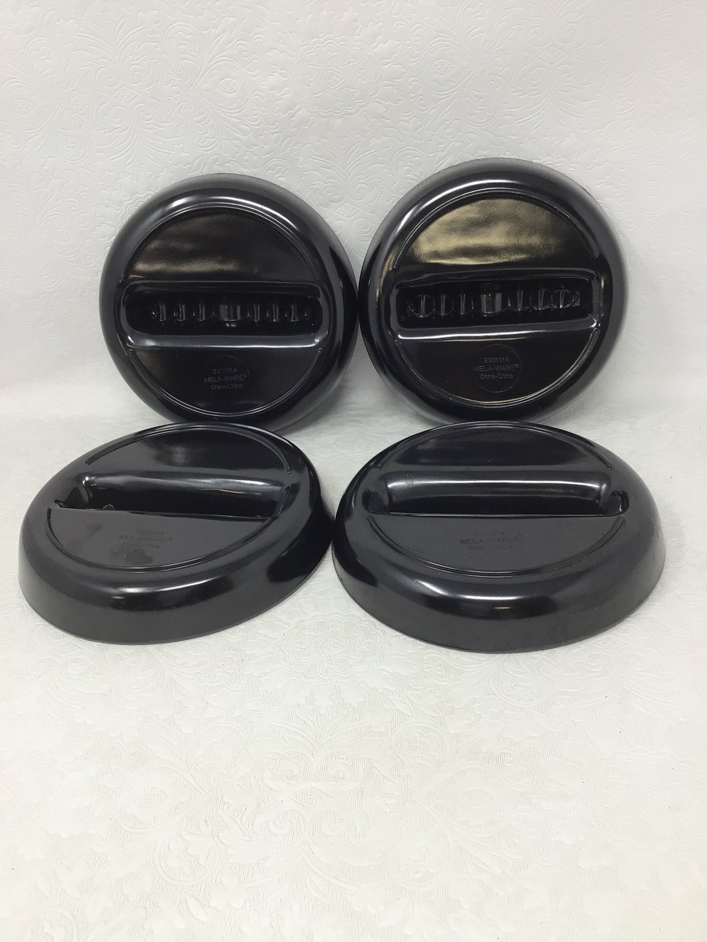 Four Plastic Black Ashtrays