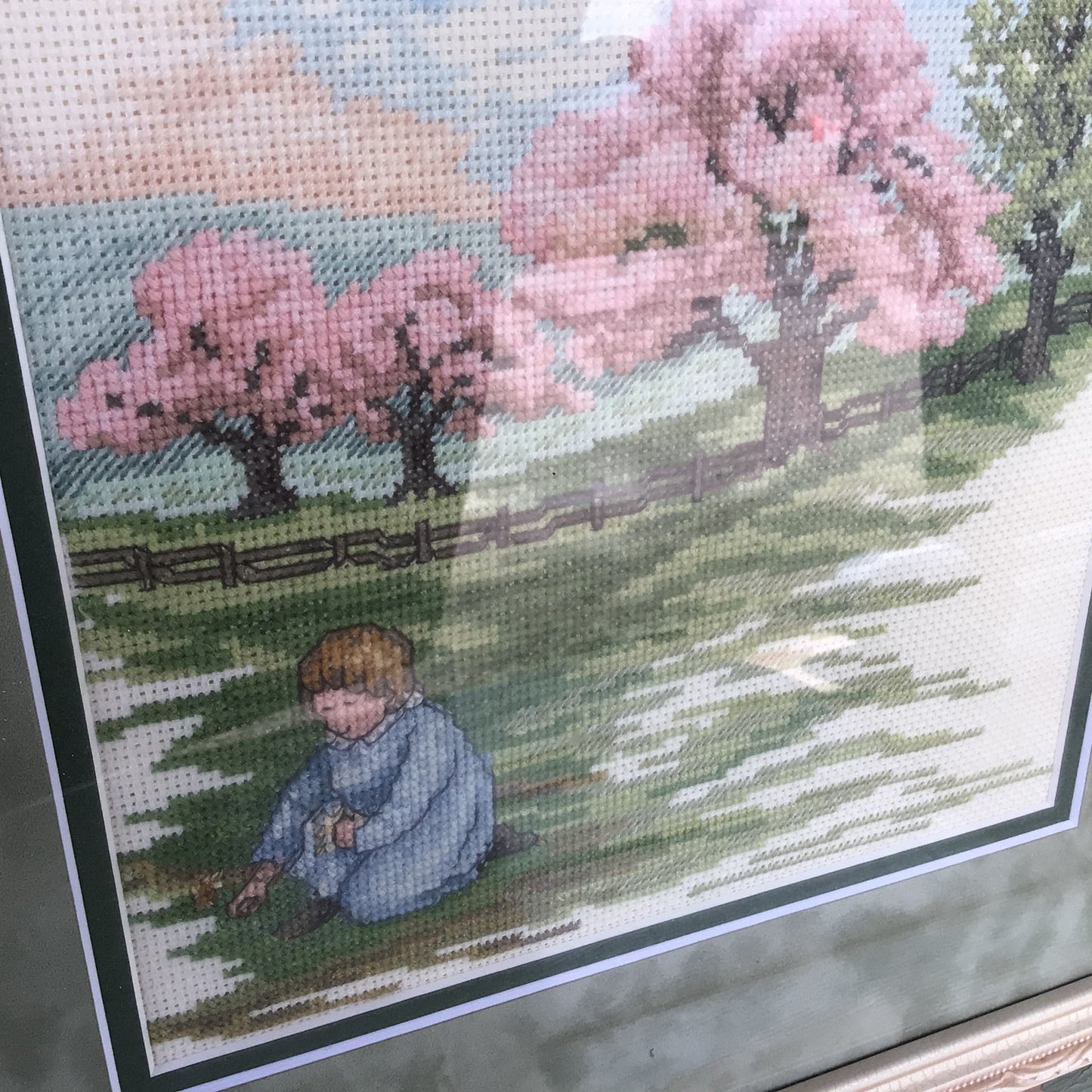 Framed and Matted “ Child in the Meadow” Cross-stitch