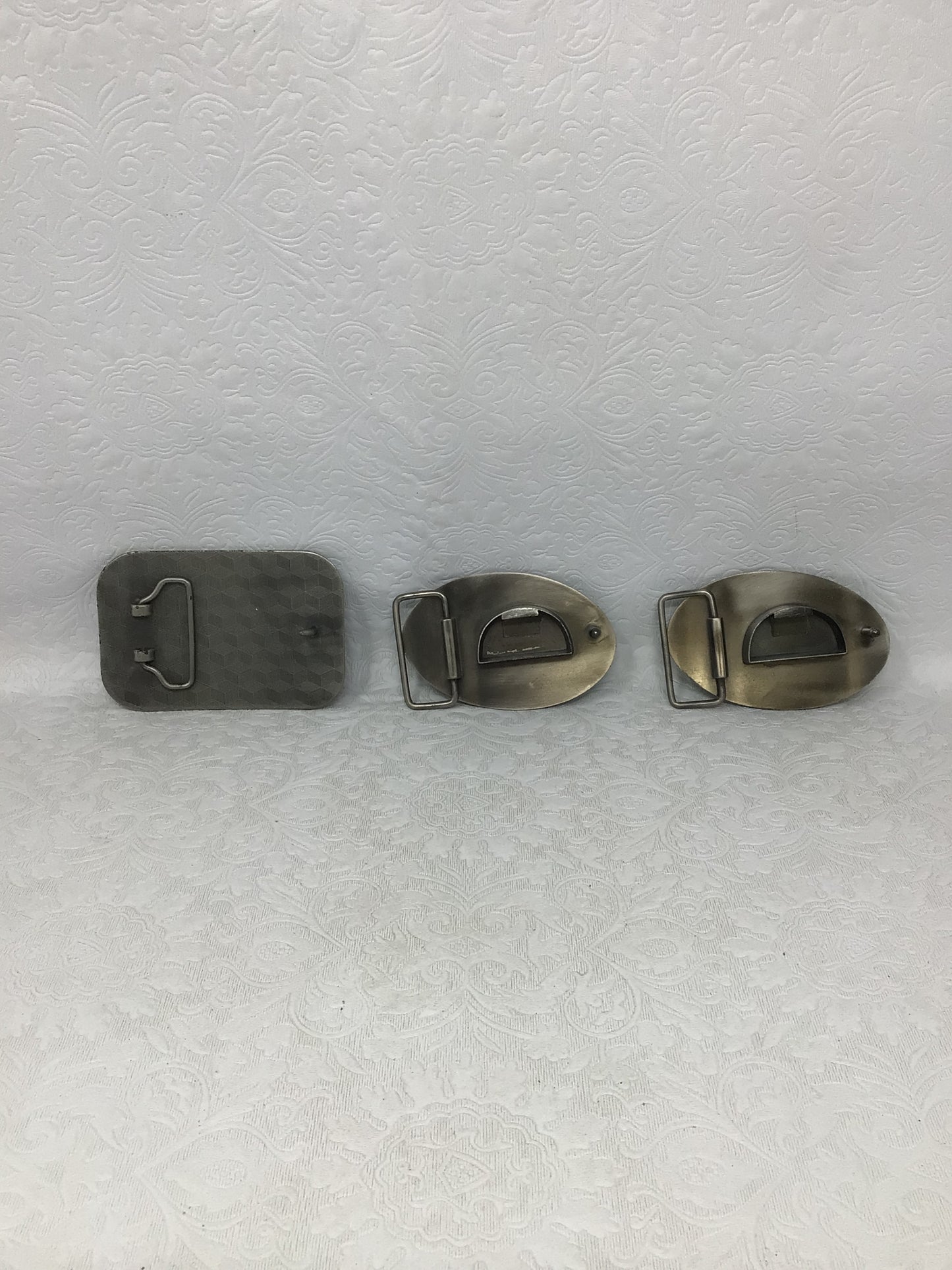Three Belt Buckles