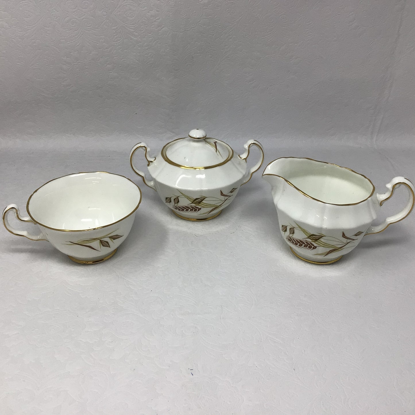 “Golden Horizon” by Northumbria Creamer, Sugar, and Teacup Set of 3