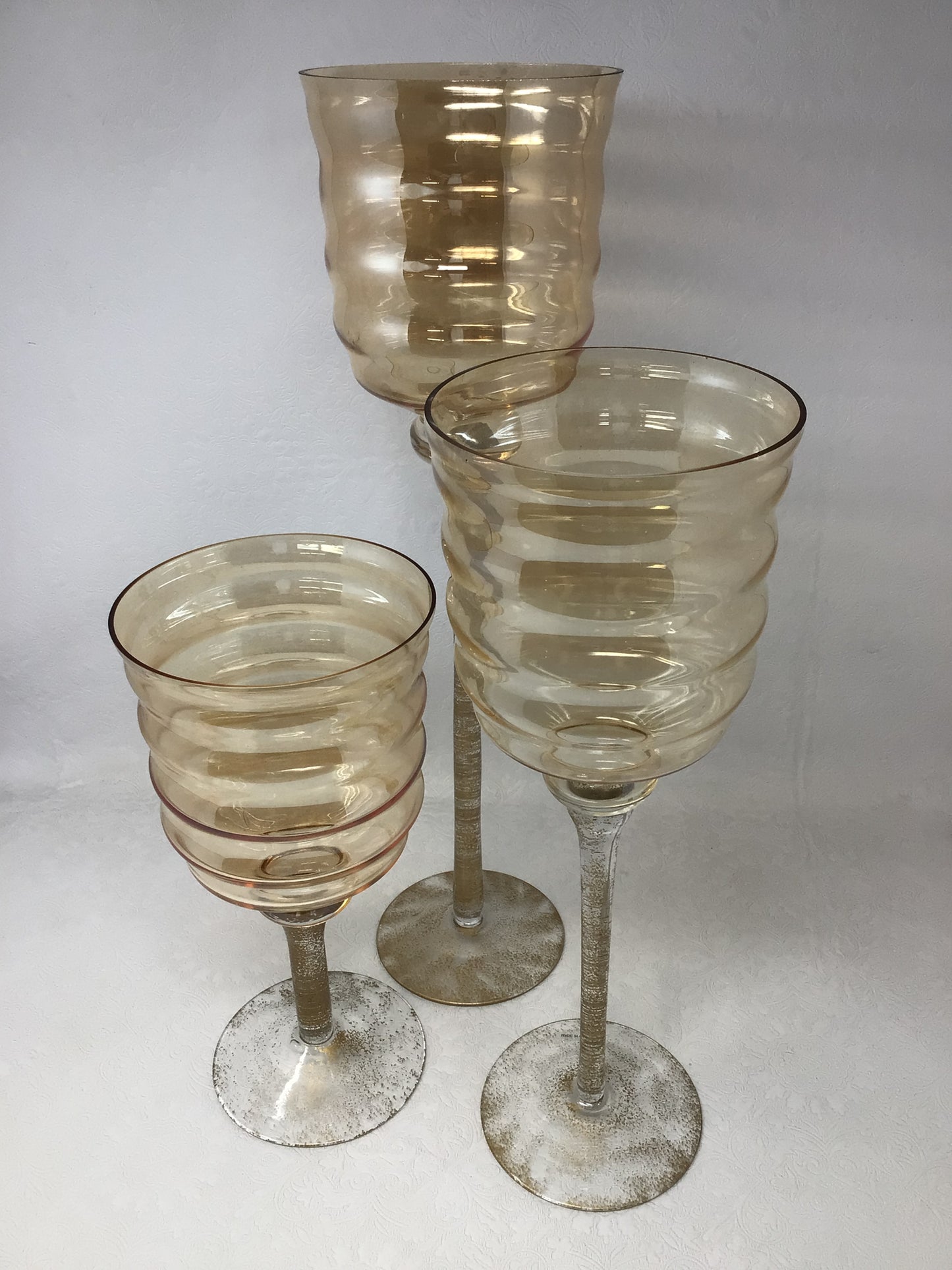 Set of Three Gold Colour Standing Vases