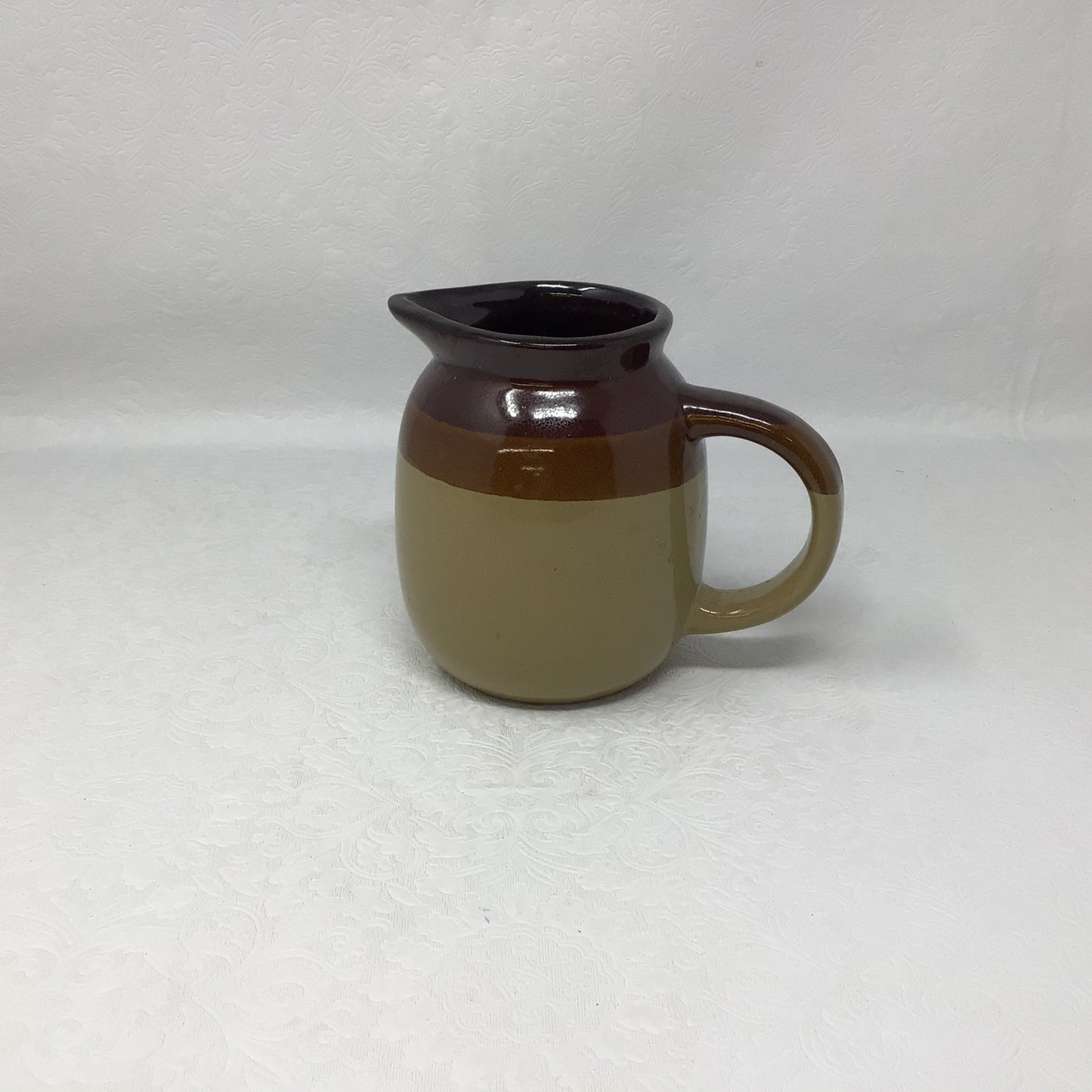 Tan and Brown Pottery Jug