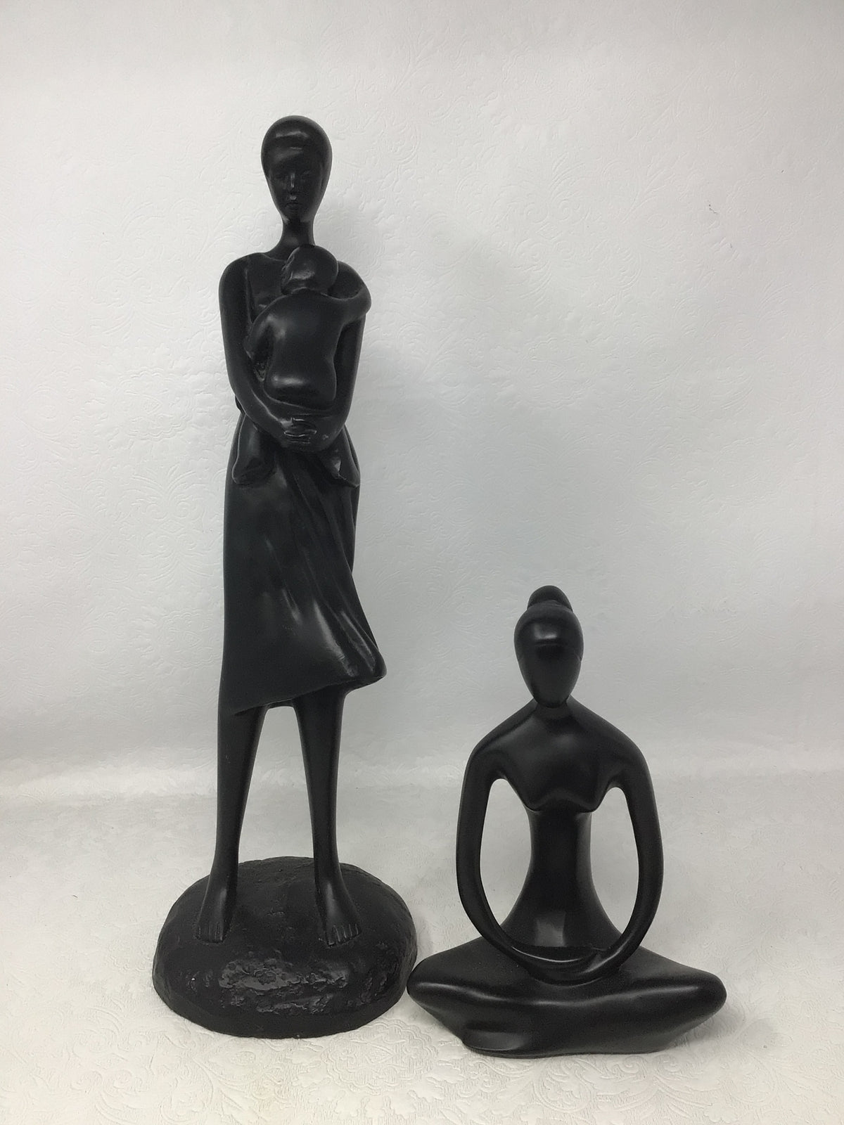 Wooden Carvings of Seated Woman and Woman Carrying Child, Set of 2