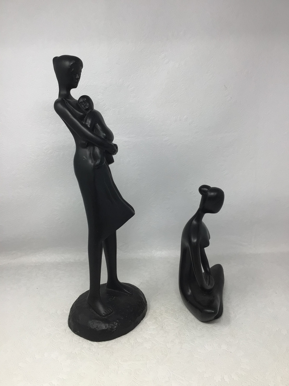 Wooden Carvings of Seated Woman and Woman Carrying Child, Set of 2