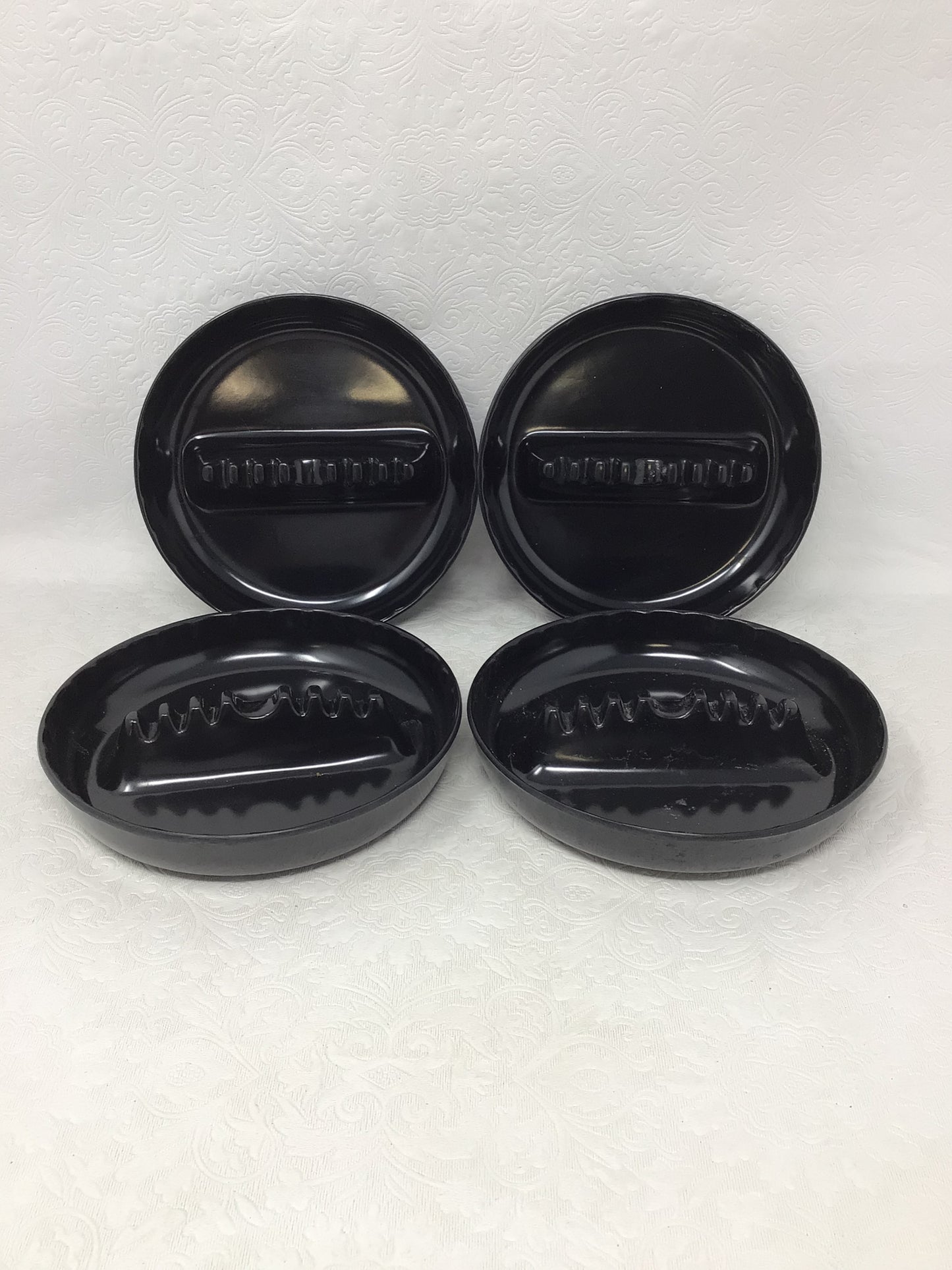 Four Plastic Black Ashtrays