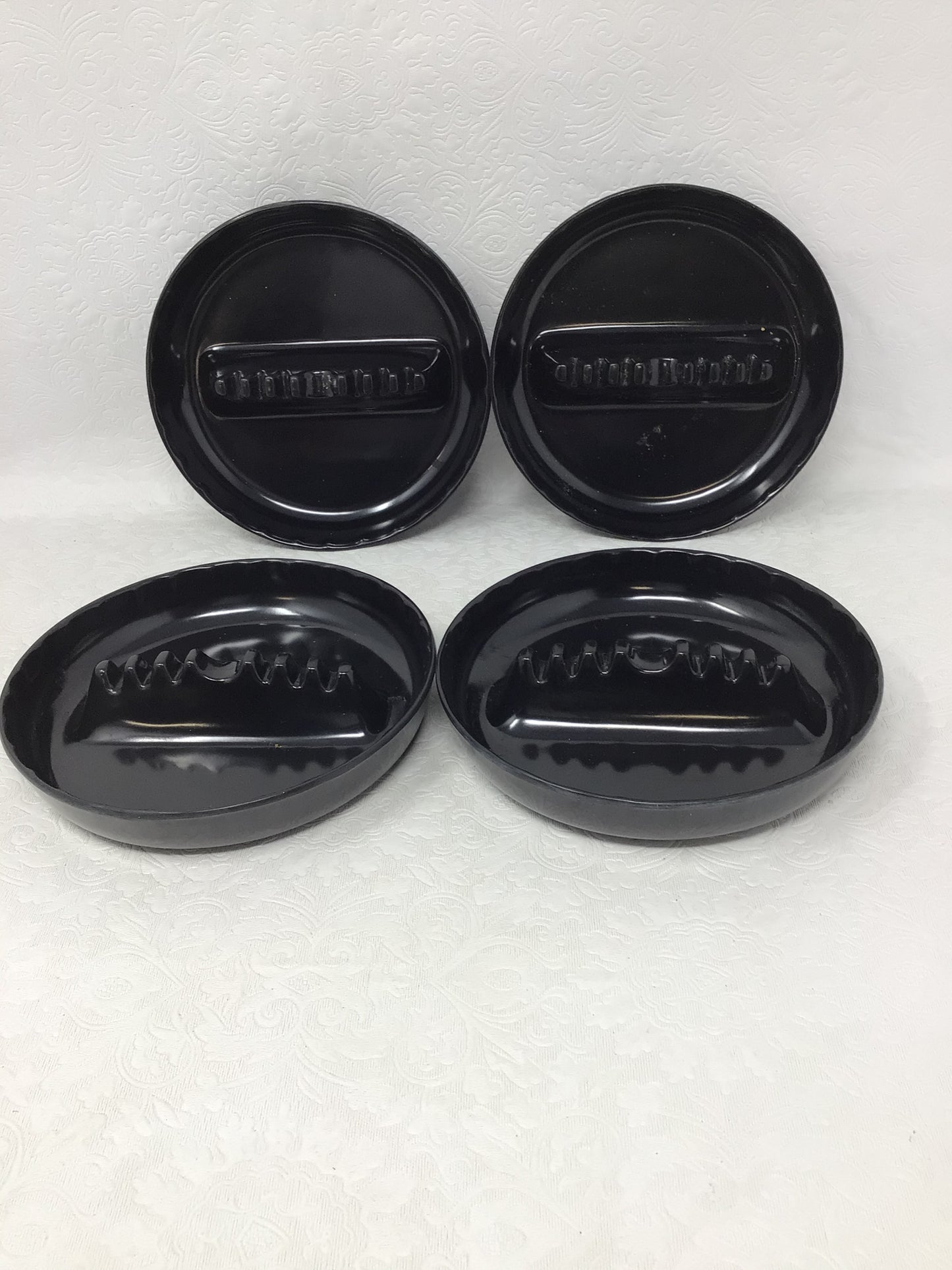 Four Plastic Black Ashtrays